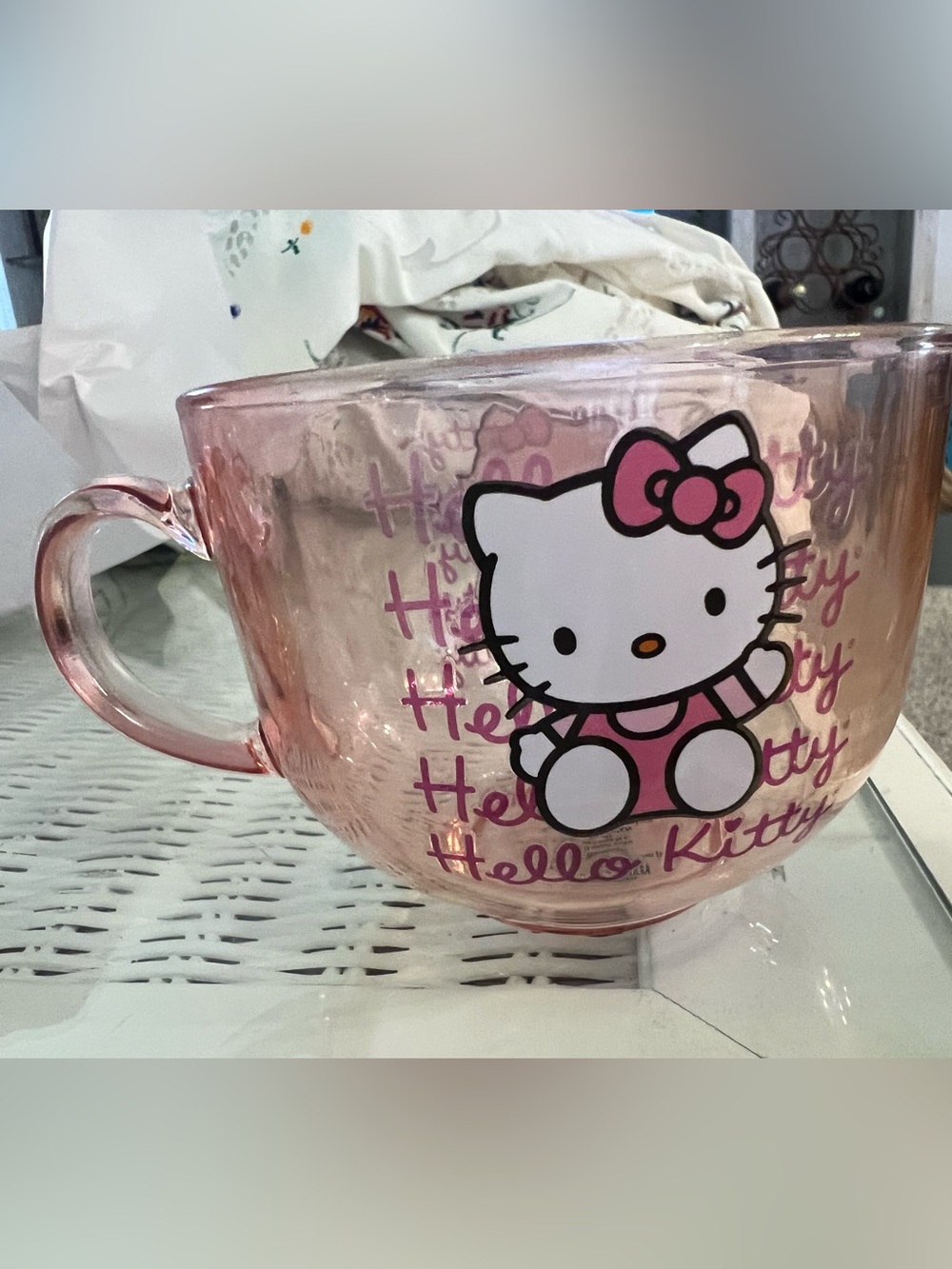 Silver Buffalo Sanrio Hello Kitty Pink Glass Mug holding 16 ounces